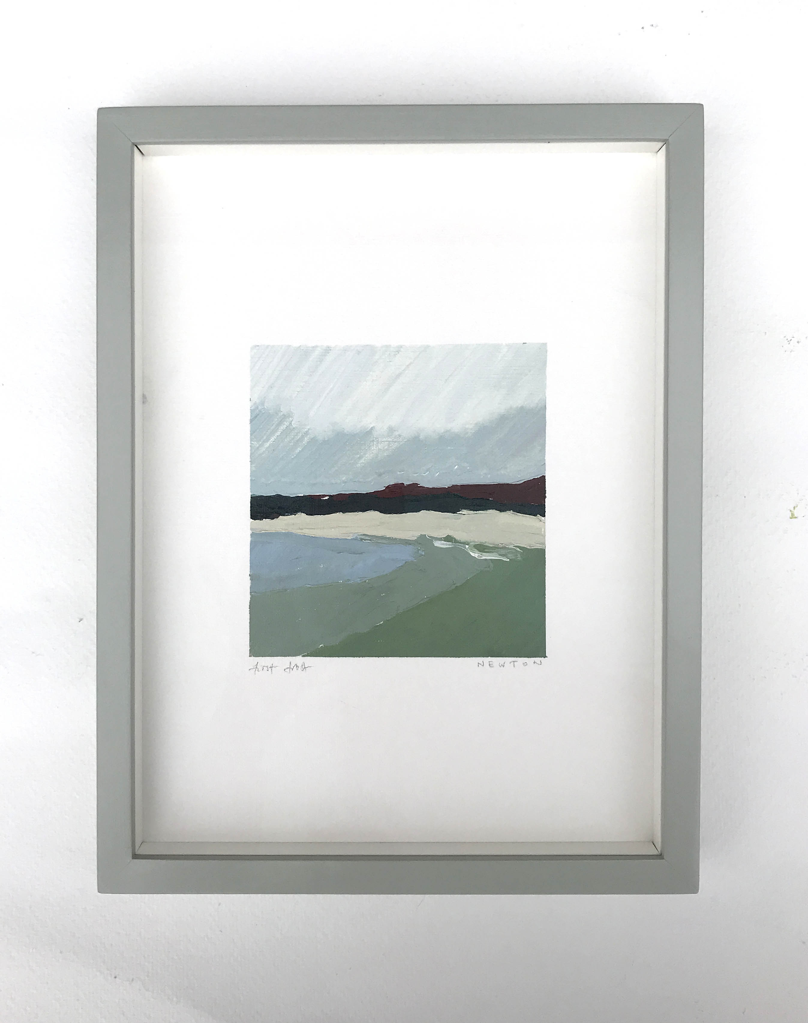 First frost by Sally Newton. Framed artwork of a landscape with mountains and water on a white wall.
