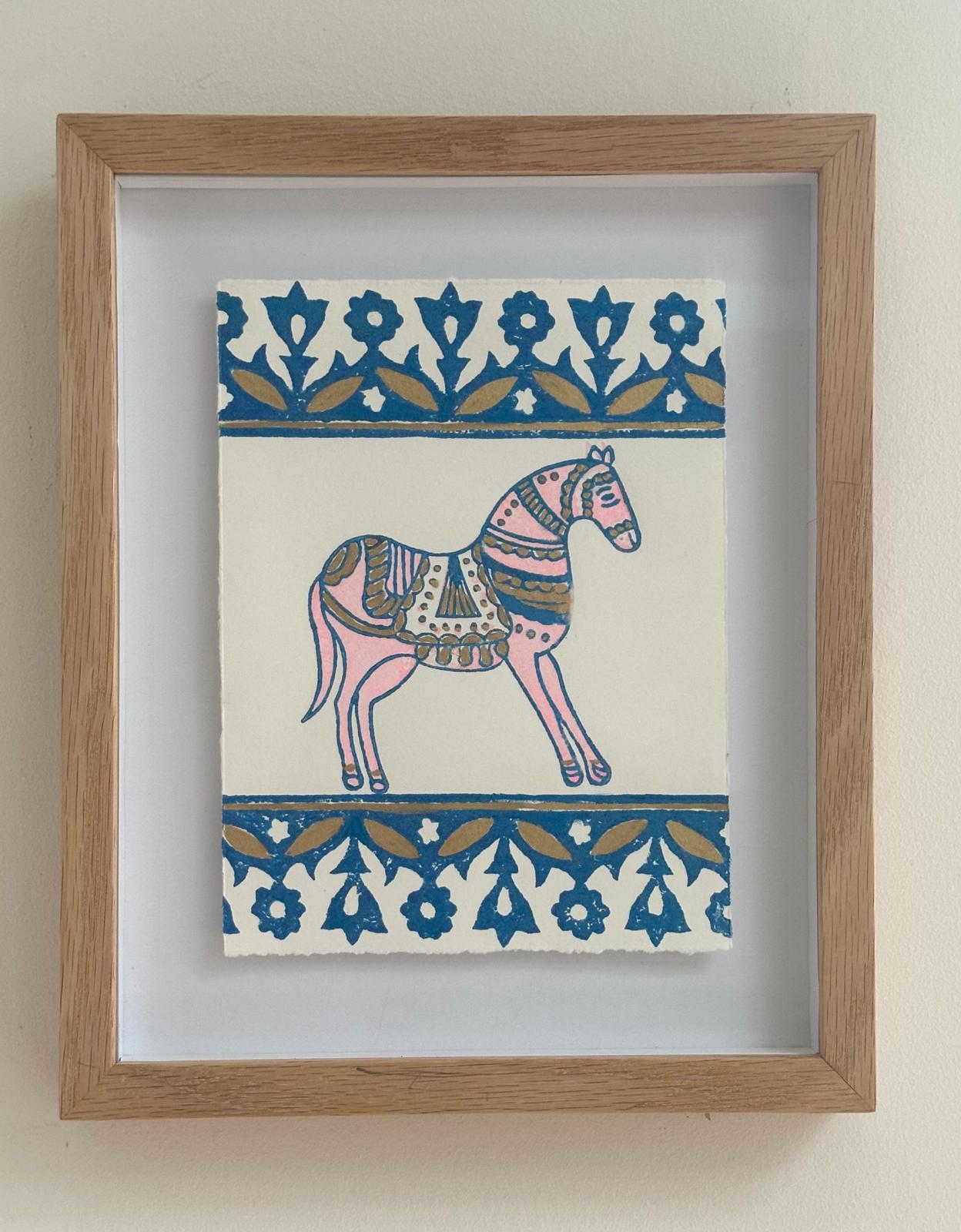 Marwari Horse, Blue by Neera Sehgal depicting a framed artwork of a blockprint horse illustration and decorative patterns on a white background