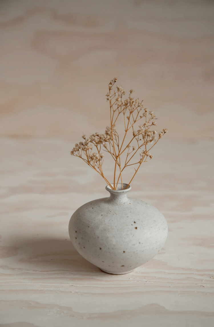 Small bud vase No. 2 in Swallow, with buds, by ceramicist Charlie Maw
