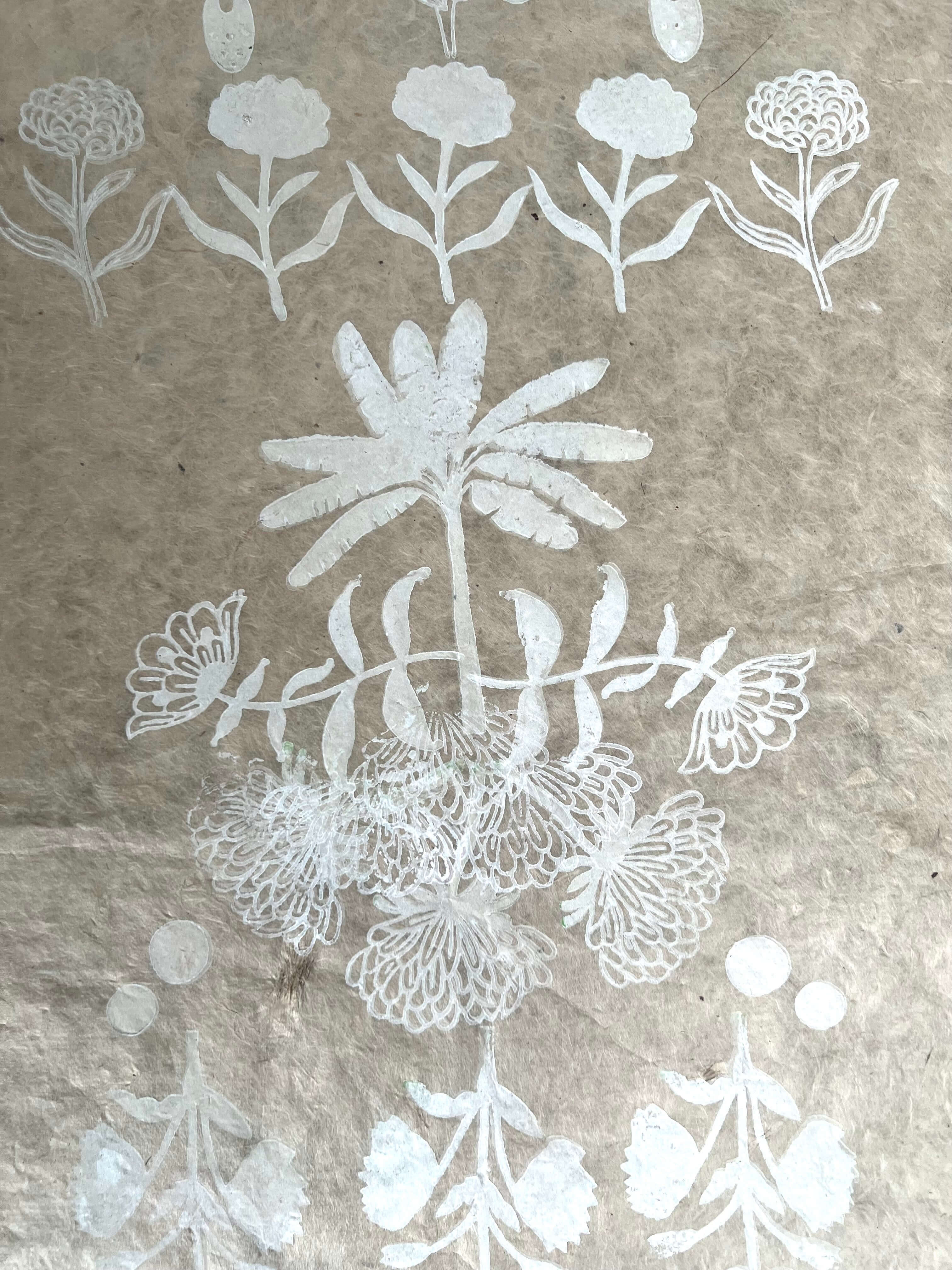 Still by Neera Sehgal depicting Indian block print white floral pattern on a textured brown background