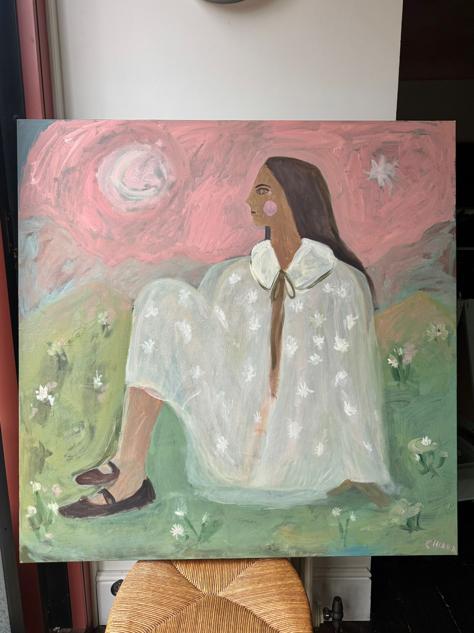 After Rain Pink Skies painting of a woman sitting in nature, by Chiara Perano