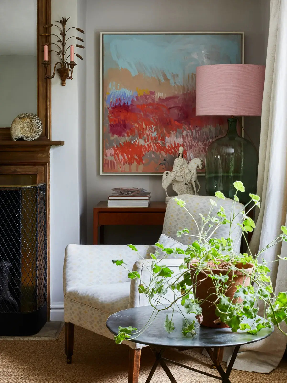 Large abstract painting with pink red and blue tones in sitting room of georgian farmhouse in Hampshire art consultancy