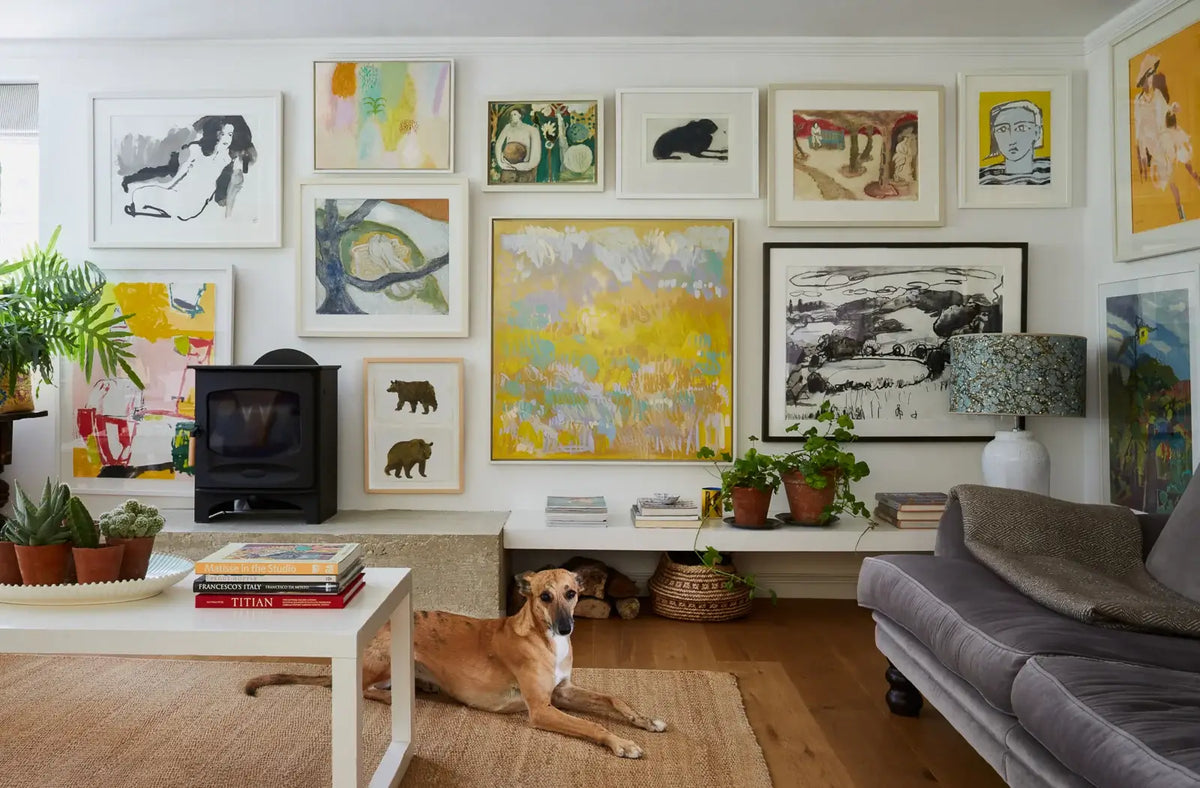 colourful gallery wall in contempory sitting room of Hampshire farmhouse Mylo Art consultancy