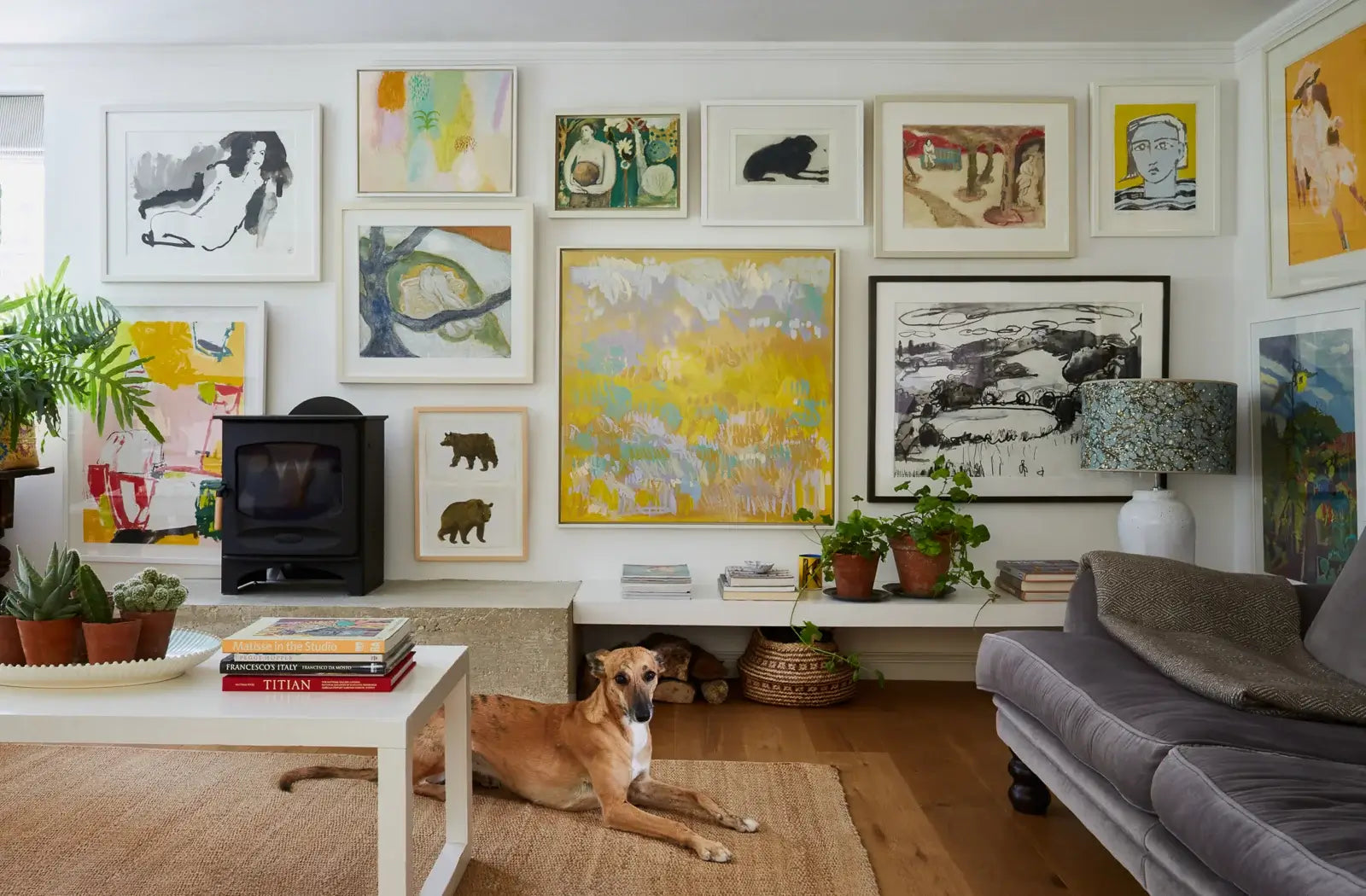 colourful gallery wall in contempory sitting room of Hampshire farmhouse Mylo Art consultancy