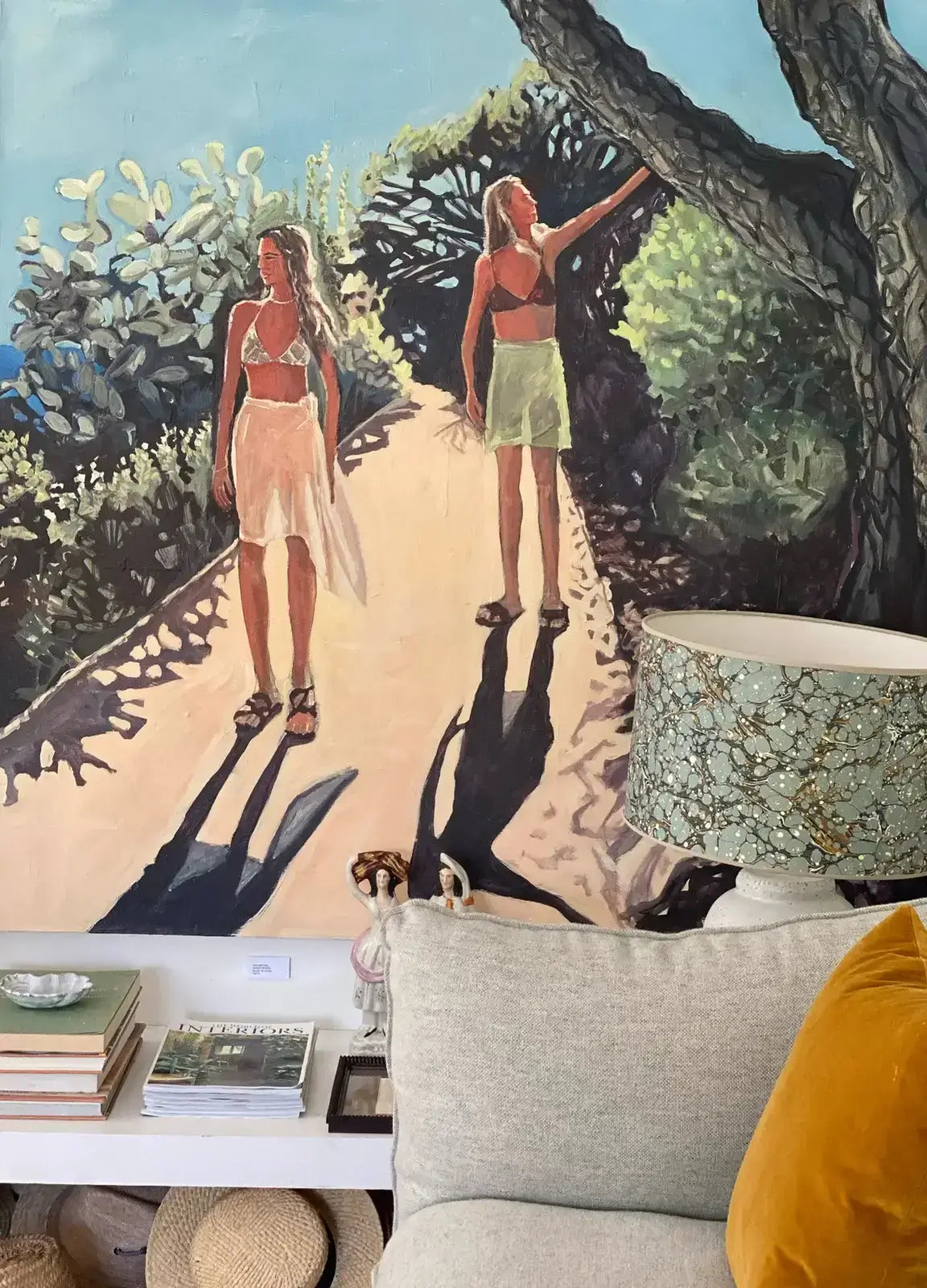 large Lizbeth Holstein painting with coffee table and lamp in front in sitting room art advisory 