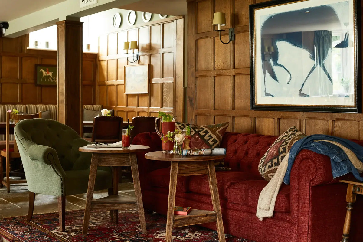 Kate Boxer Wolf in dark frame on wood panelled pub walls by Mylo Art consultancy