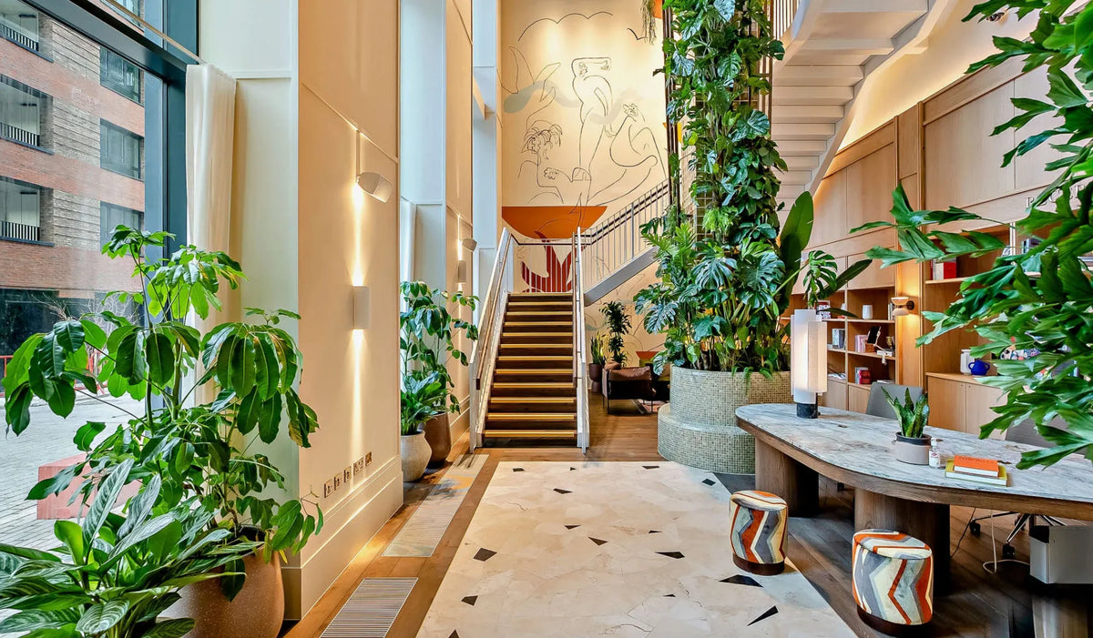 Polly Arnot large figures mural staircase branded living Riverstone Heights London art consultancy london adc tunea