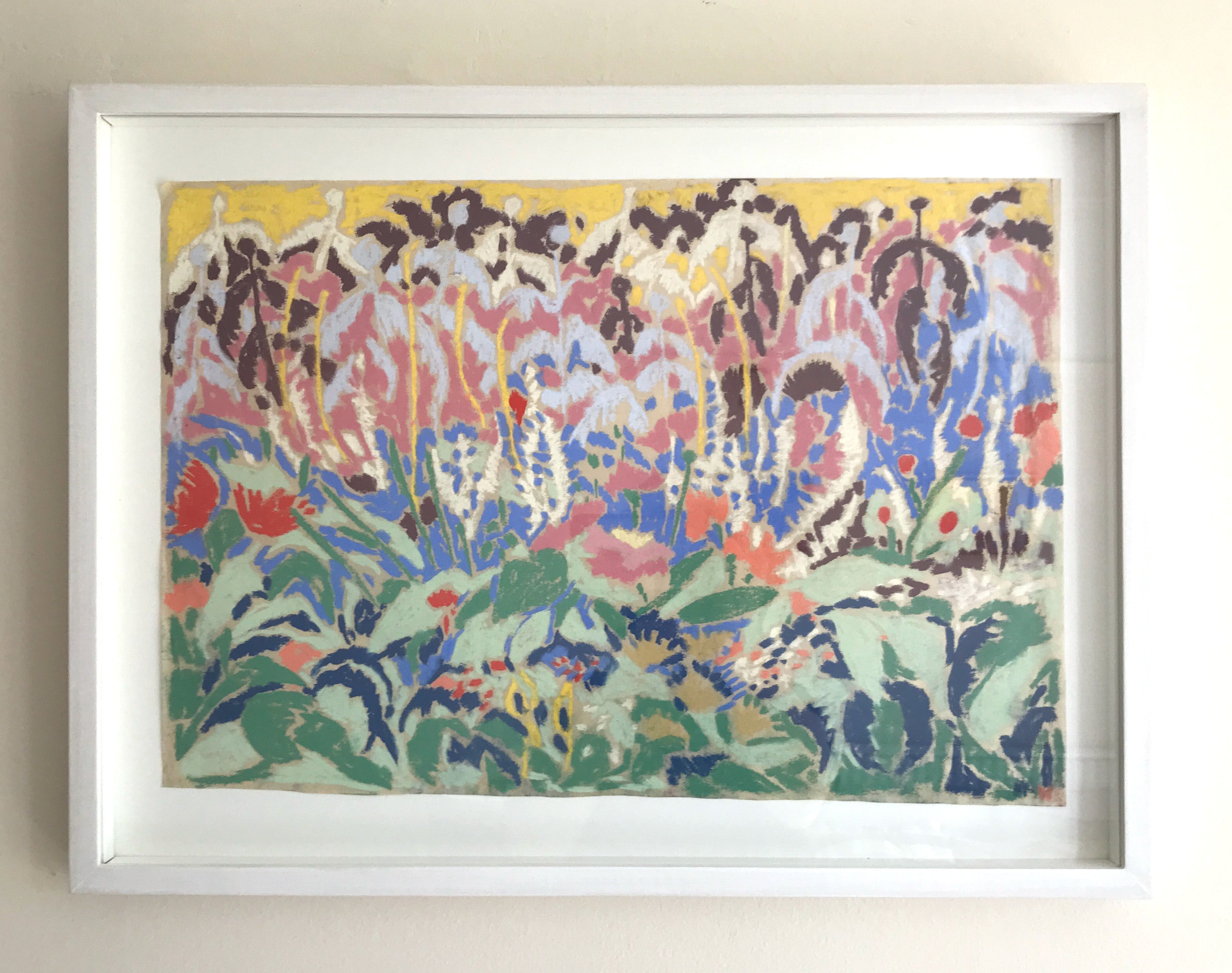 Echinops garden by Sally Newton. Framed abstract artwork with colourful patterns on a beige wall.