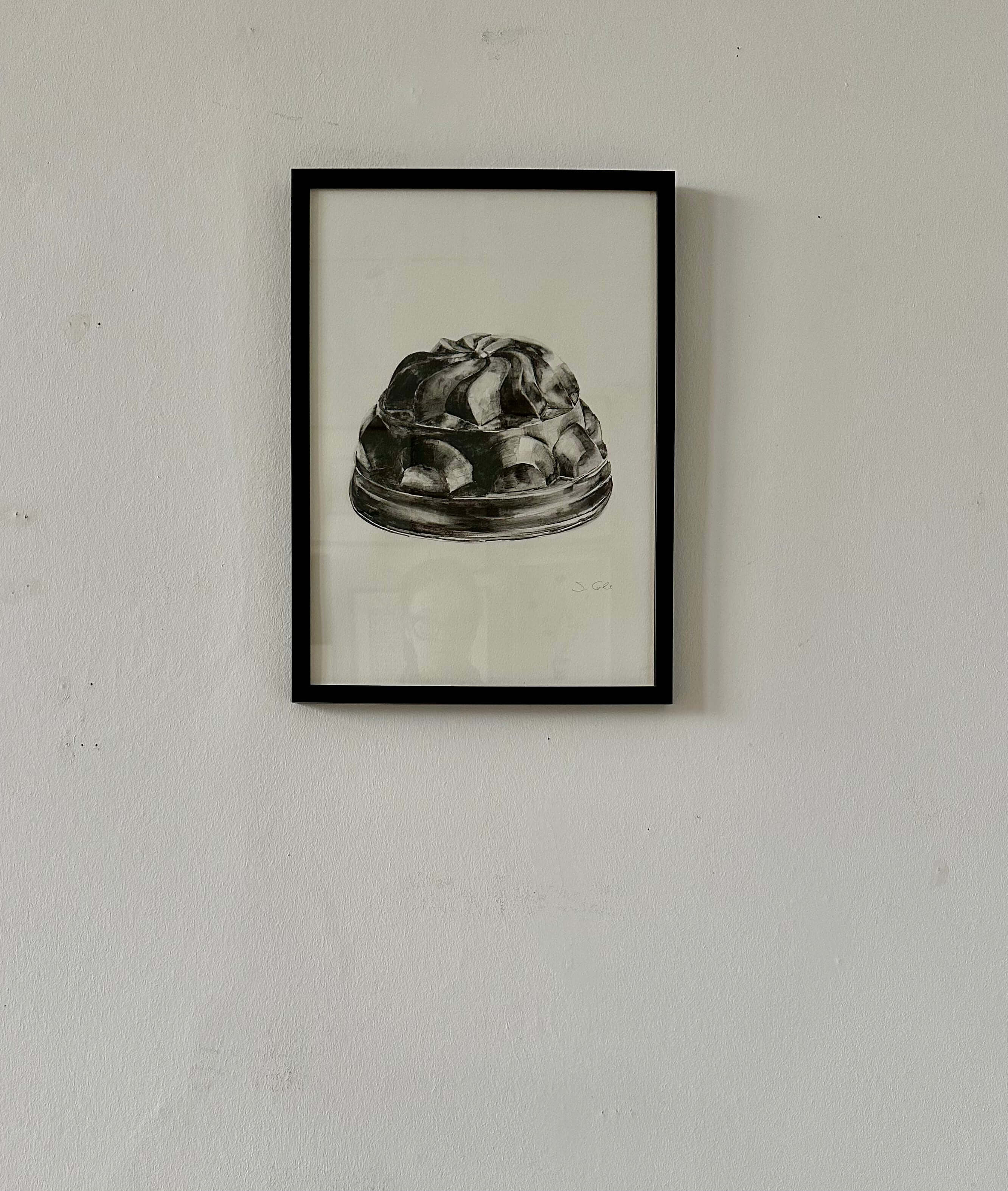 Jelly Mold by Sophie Cole. Framed black and white artwork of a jelly mould on a light neutral wall.