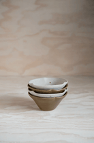 Stack of 4 small petal bowls by ceramicist Charlie Maw