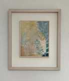 Secret Messages by Tara Leaver. Framed artwork with a shell and beach scene on a white wall.