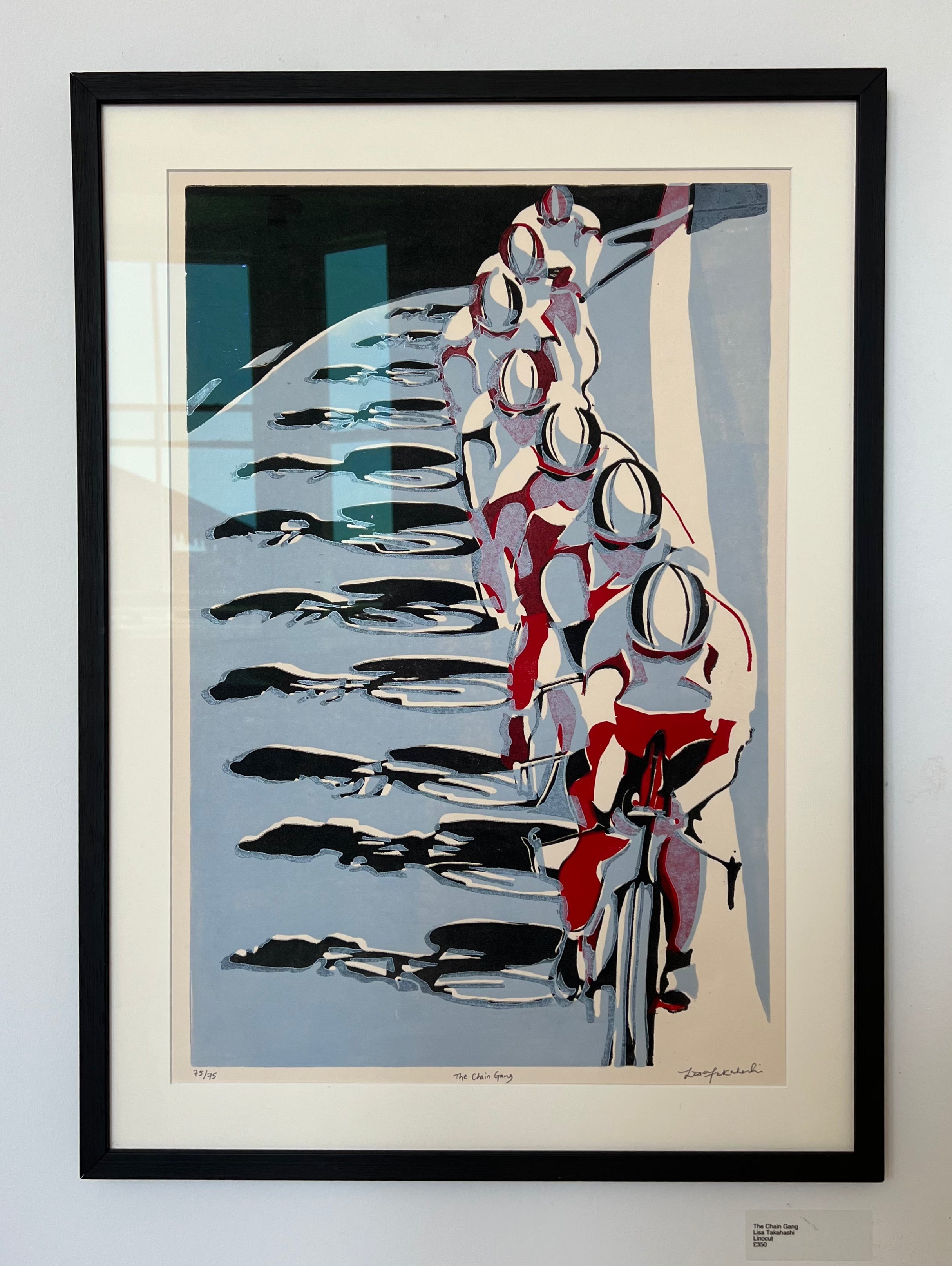 Framed abstract artwork with geometric shapes on a light gray background